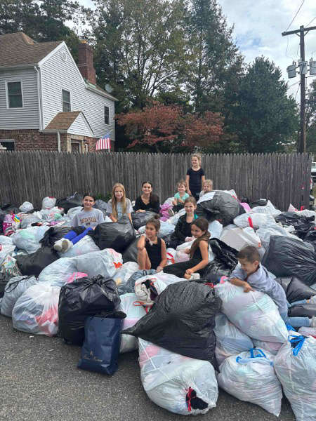 Volunteers carrying donation bags during Go Green fundraiser