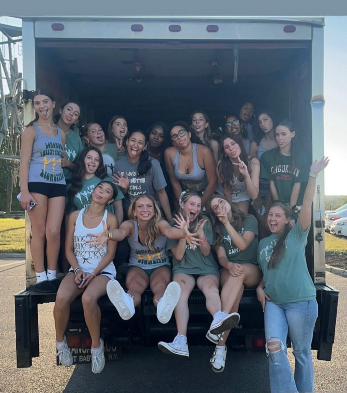 Volunteers loading donation bags into the Go Green Clothing Drive truck